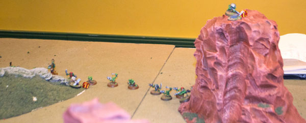 The Gretchin have sat out the battle, but suddenly realize a high-prize objective sits atop the mesa at right.