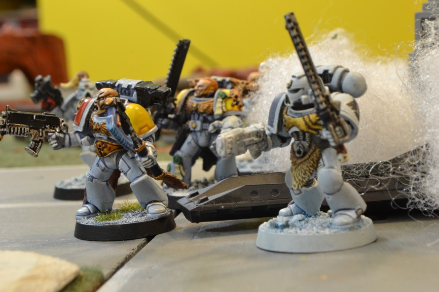 Brother Grimblood exits the drop pod amidst billowing steam and dust. The veteran Astarte's feral appearance and animalistic violence terrified every opponent he faced.